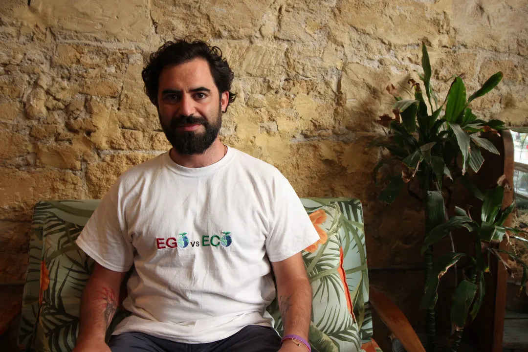 Portrait of a smiling man in a white t-shirt
